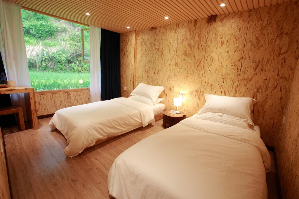 Tong Sang Art Hotel Liping Habitación foto